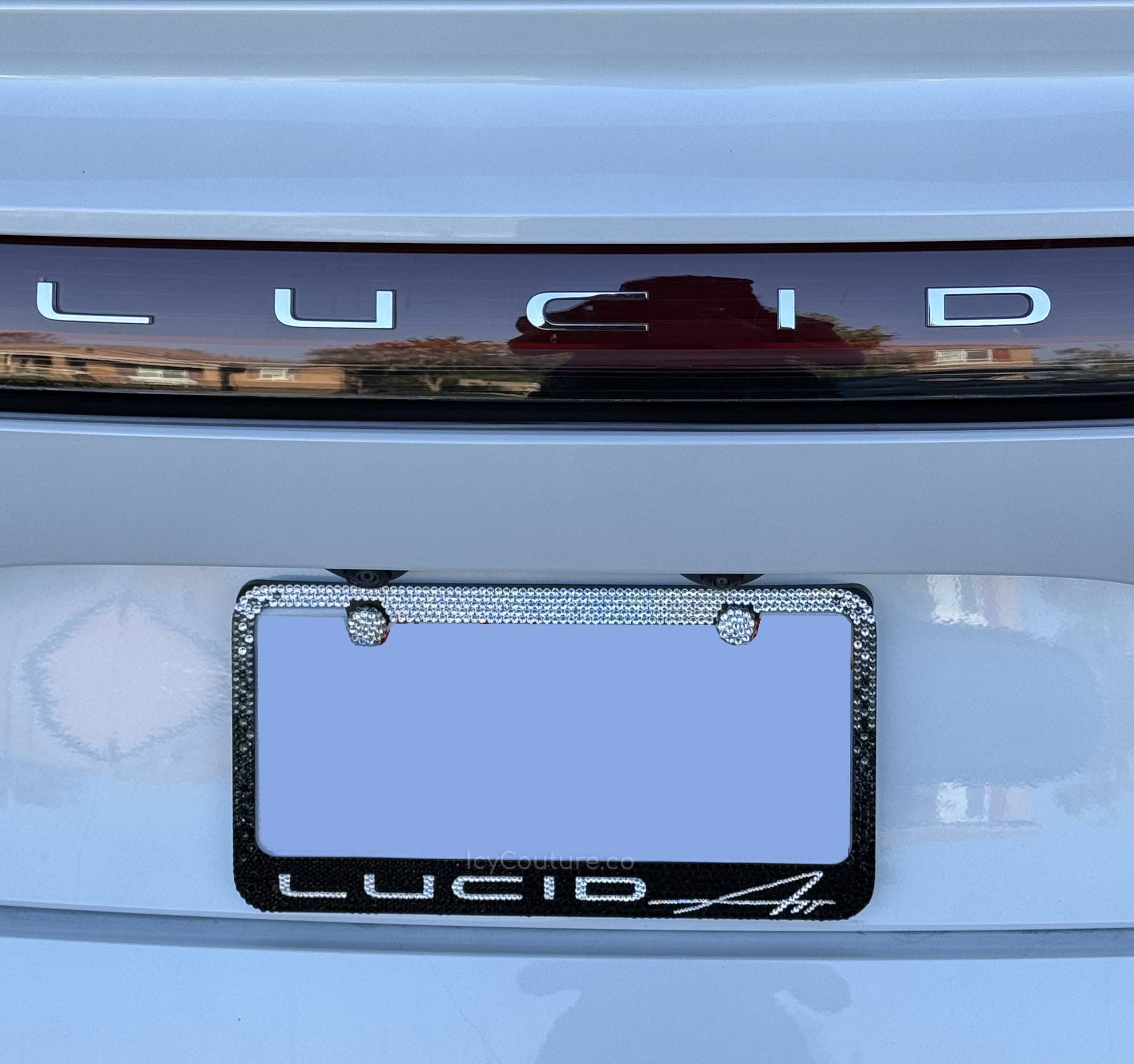 Crystallized 'Lucid Air' License plate frame on a back of Lucid car, featuring Black Diamond Ombre Design with Swarovski Crystals by ICY Couture.