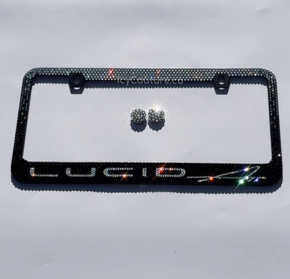 Lucid Air License Plate Frame Sparkling in Black Diamond Ombre Crystallized Design n a Black license plate holder with matching Crystal screw caps covers.