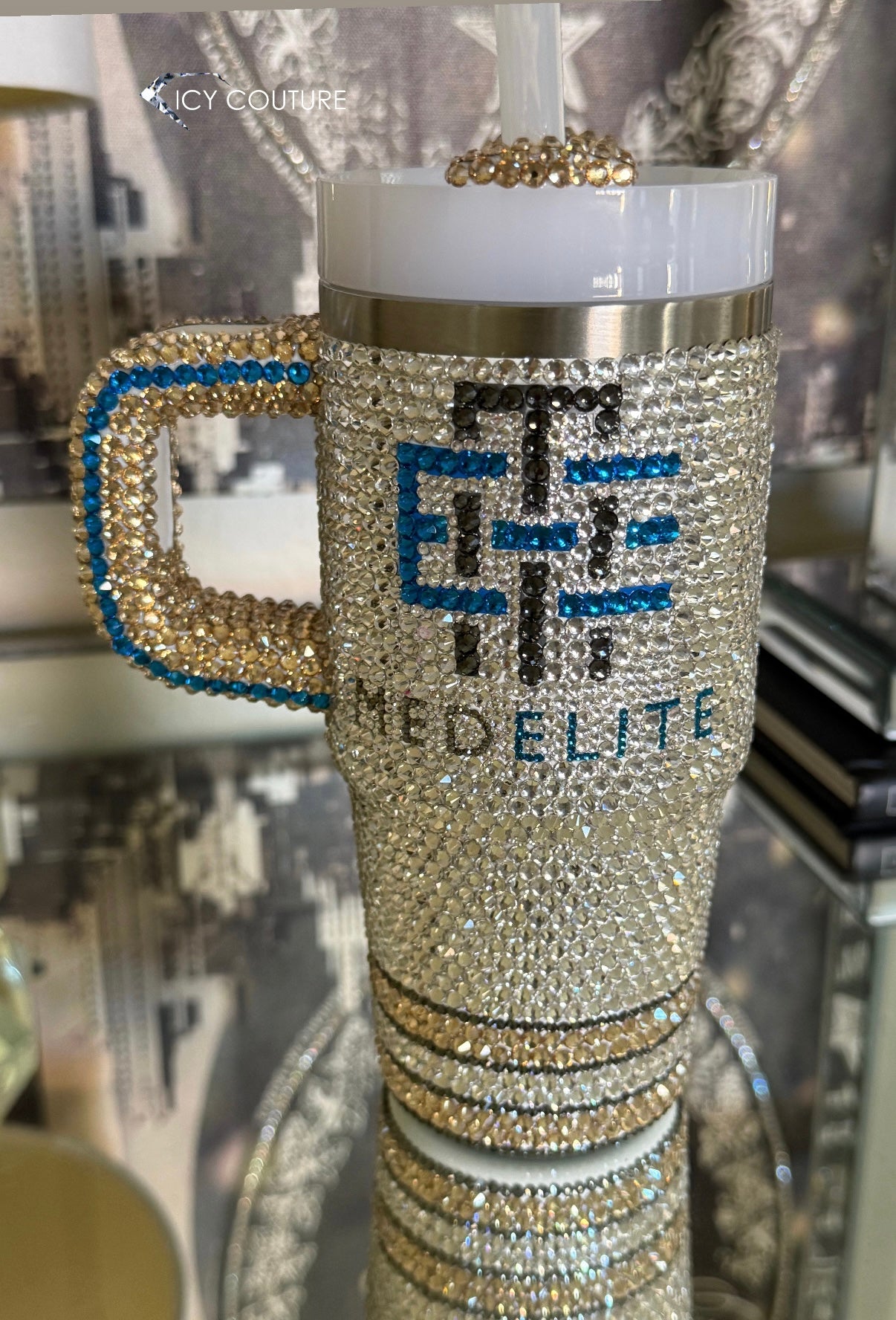 CUSTOM CRYSTALLIZED STANLEY TUMBLER CUP WITH MEDELITE LOGO FEATURING CLEAR RHINESTONES WITH BLACK DIAMOND WITH SAPPHIRE LOGO AND GOLDEN ACCENTS