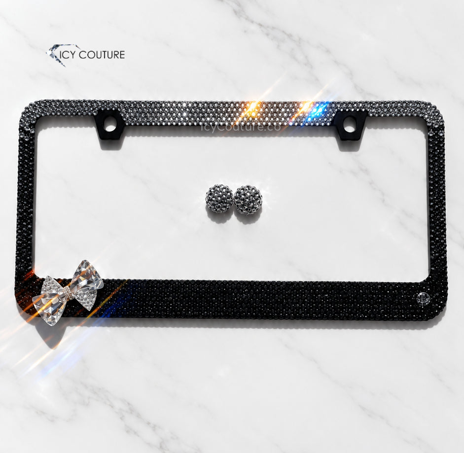 Black crystal bow license plate frame with ombre rhinestone design by ICY Couture, hand-crystallized for luxury car gifts and custom automotive accessories.