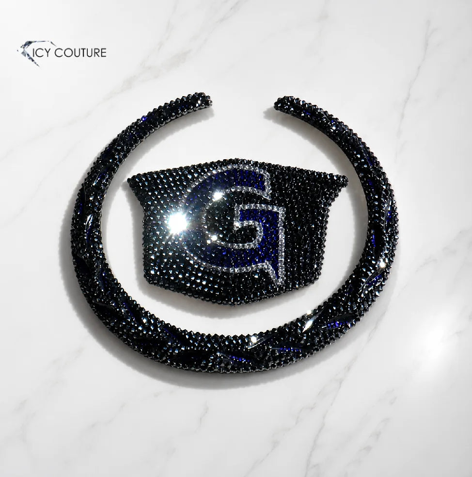 Custom Cadillac crystal emblem with black rhinestones and initial in the classic wreath and crest design by ICY Couture, a luxury personalized car accessory.