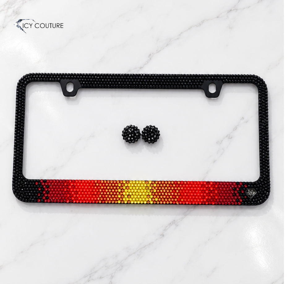 Lava ombre crystal license plate frame by ICY Couture with black rhinestones, red crystals, and yellow center detailing on  luxury bling car accessory.