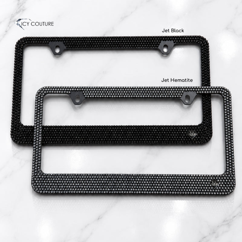 Crystal license plate frames by ICY Couture showing Jet Black and Jet Hematite rhinestone finishes, hand-crystallized luxury bling car accessories for black car owners.