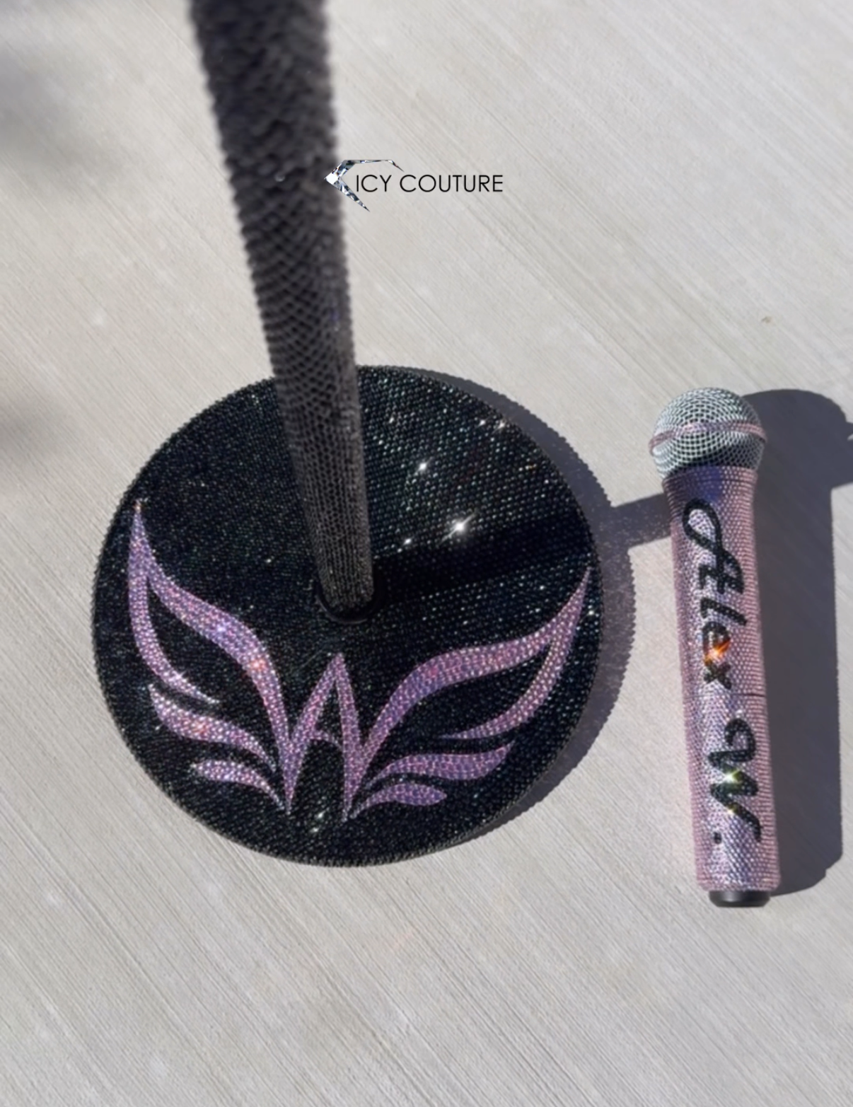 Close-Up Of Custom Logo In Light Rose Rhinestones On Black Crystal Microphone Stand