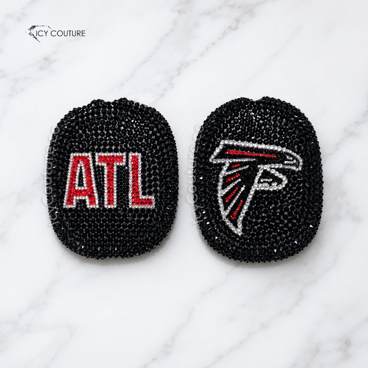 Custom black crystal AirPods Max ear covers with ATL lettering and Atlanta football-inspired falcon design, hand-crystallized by ICY Couture for luxury sports fan gifts and custom headphone accessories