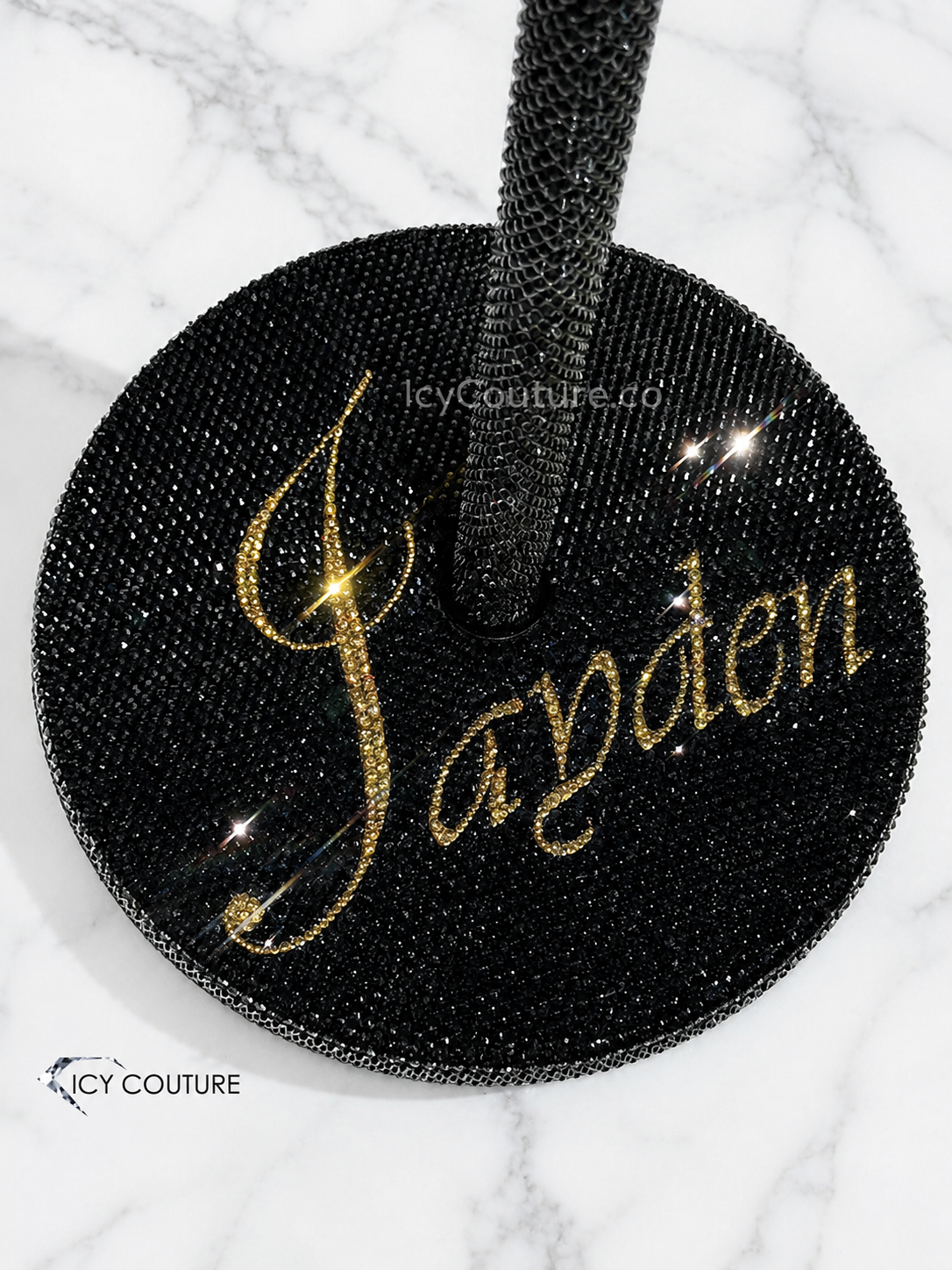Custom black crystal mic stand base by ICY Couture with gold rhinestone name detail, hand-crystallized for personalized luxury stage accessories and custom performance setups.