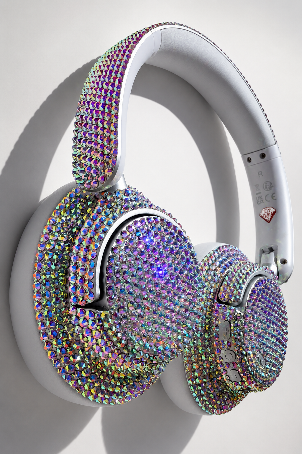 Custom white headphones bedazzled with iridescent Crystal AB rhinestones by ICY Couture