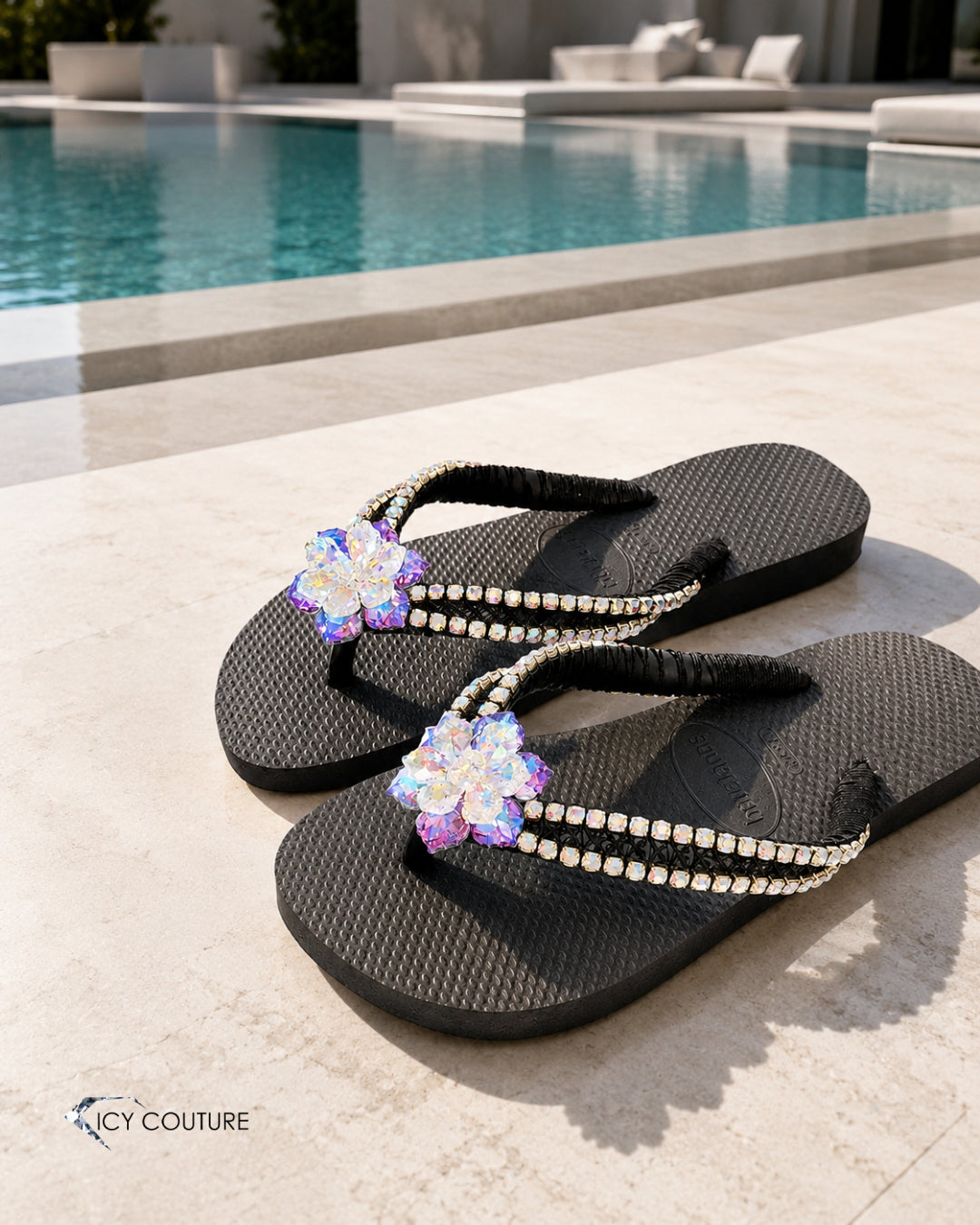 Custom Crystal Havaianas Flip-Flops By ICY Couture With XL Hawaiian Flower And Rhinestone Chain Detail, Styled Poolside For Luxury Resort Wear, Beachwear, And Personalized Bling Sandals.