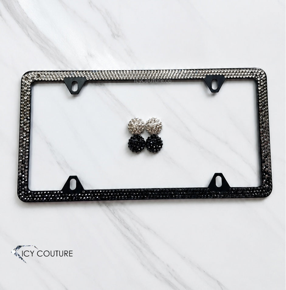 Custom crystal license plate frame by ICY Couture with black and clear rhinestones plus matching crystal screw caps for personalized luxury car styling.