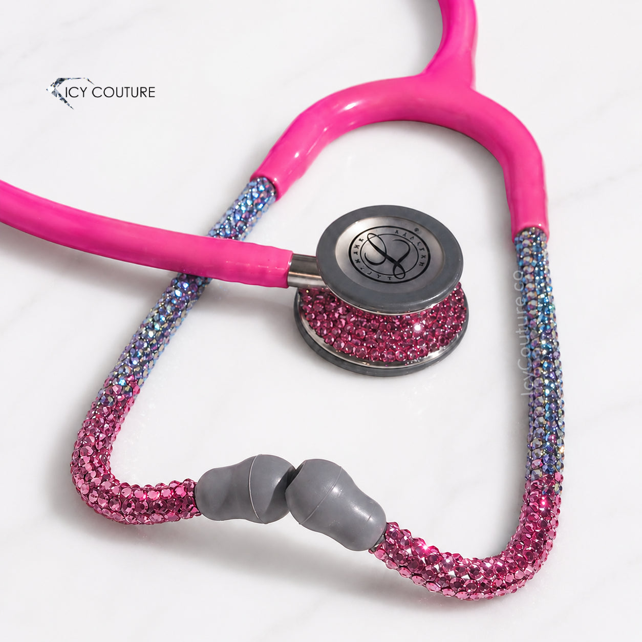 Custom ombre crystal stethoscope by ICY Couture with pink tubing and Swarovski Crystals in Rose, Tanzanite, and Aquamarine AB for a luxury personalized medical gift.