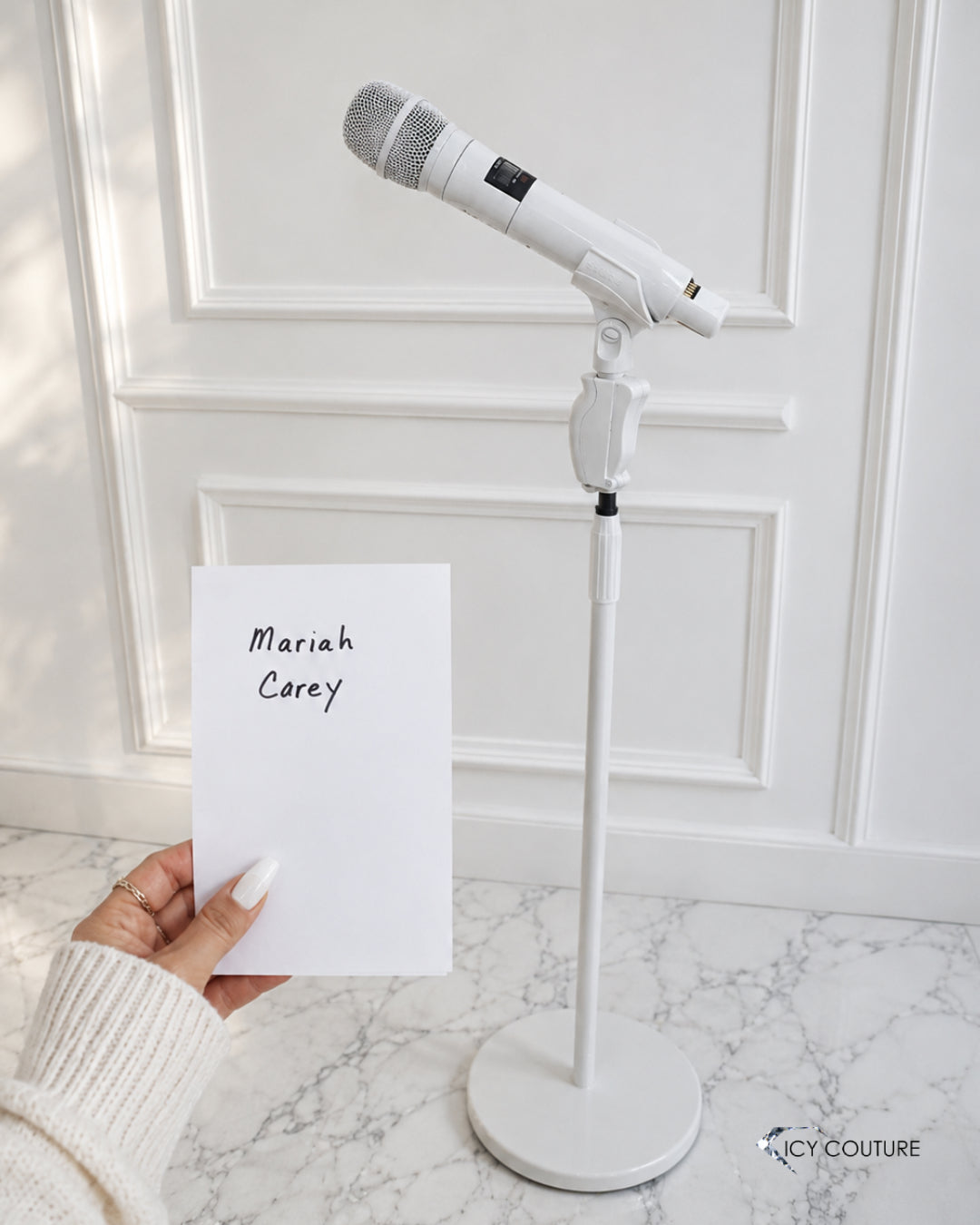 Custom white microphone and matching mic stand by ICY Couture for Mariah Carey, shown in a clean luxury setting as an example of bespoke stage accessories with custom coated service.
