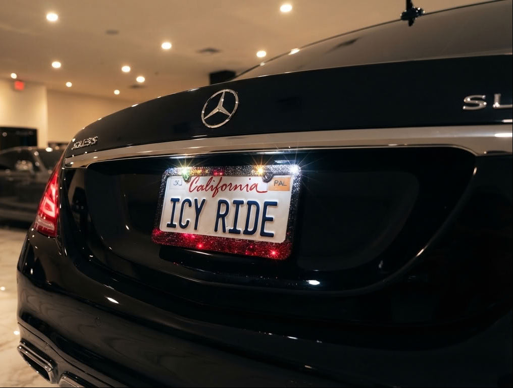 Close up on installed Rock Chick Crystal License Plate Frame design by ICY Couture with Clear, Black Diamond to Red ombre for luxury car makeover. 