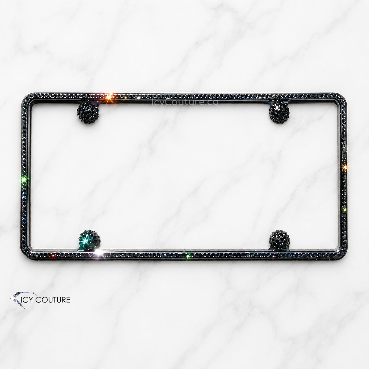 Minimalistic crystal slim license plate frame by ICY Couture with Black Diamond Swarovski Crystals detailing and matching crystal screw caps for luxury car customization.