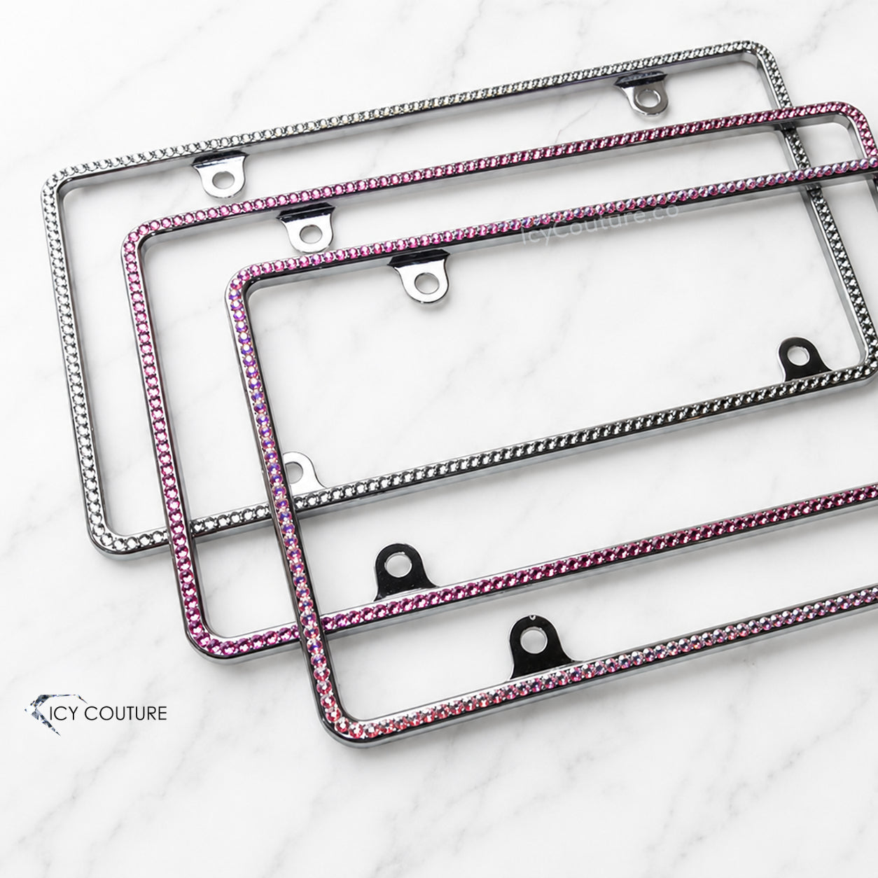 Minimalistic crystal  license plate frames with 4 screw holes by ICY Couture crystallized in Clear, Pink and Iridescent rhinestones for luxury car customization.