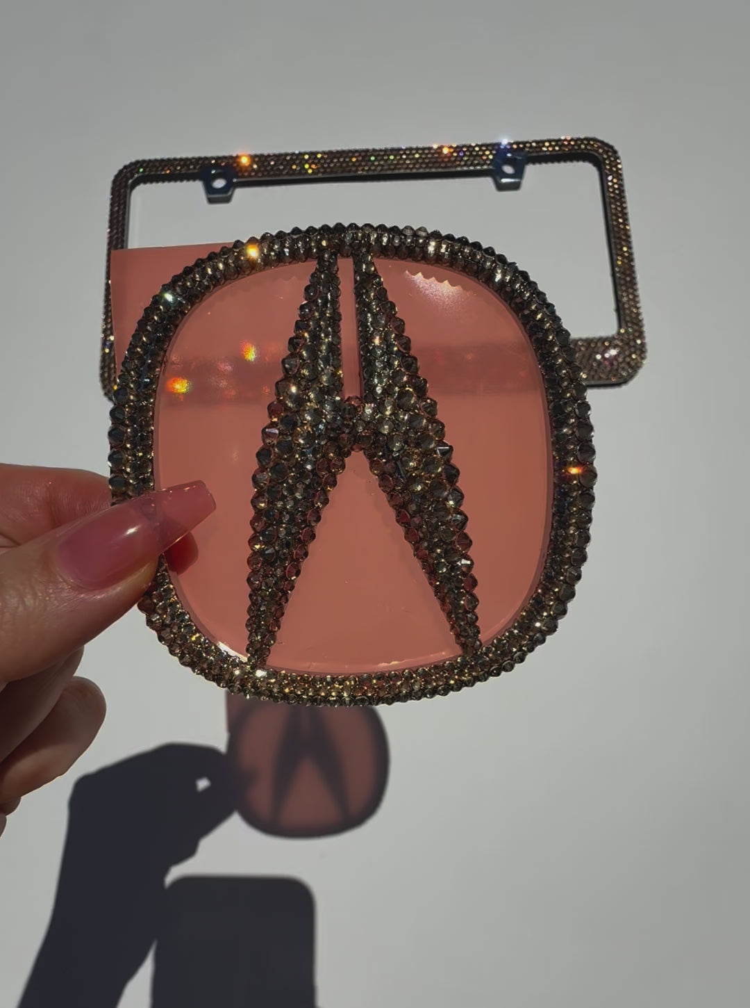 Video of Acura Emblem Customized with Golden Shadow Austrian Crystals and Matching Gold License Plate Frame by ICY Couture